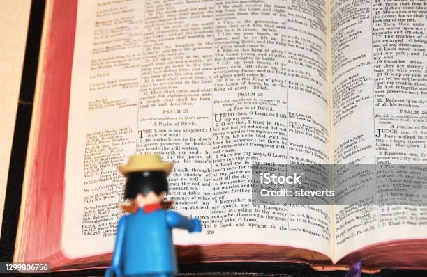 Toy Reading Bible Stock Photo - Download Image Now - Action Figure, Toy, Bible