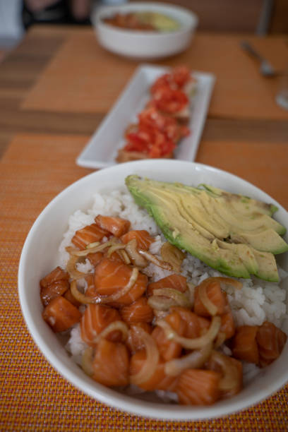istock Poke bowl with salmon served in bowl 1299806833