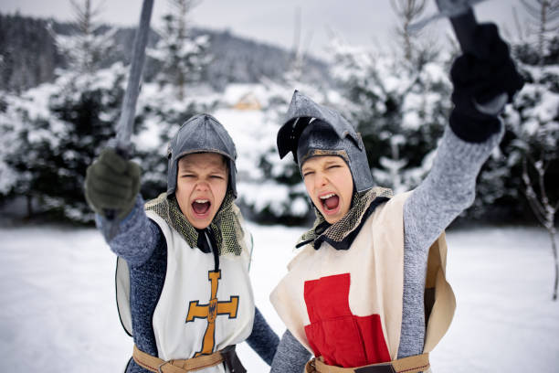 istock Little knights cheering on a winter day 1299808142