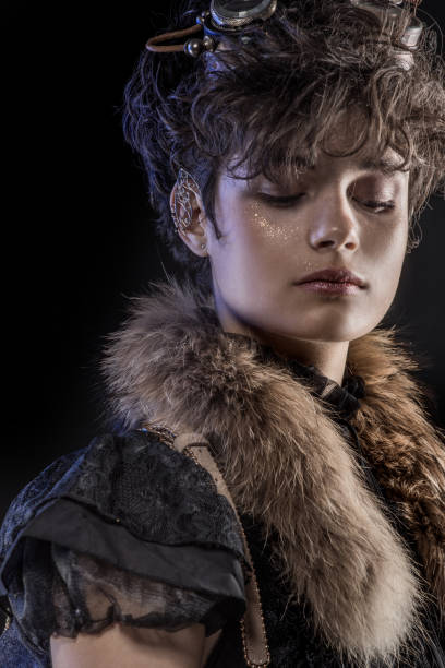 istock Headshot of a Steampunk female in a studio shot 1299808652