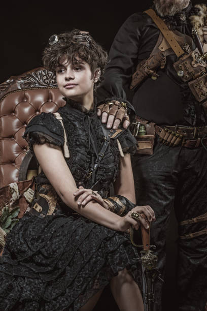 istock Steampunk female on a luxury chair in a studio shot 1299809272