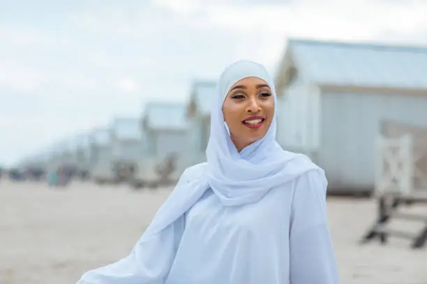 Photo of Beautiful Muslim Woman wearing hijab on the beach