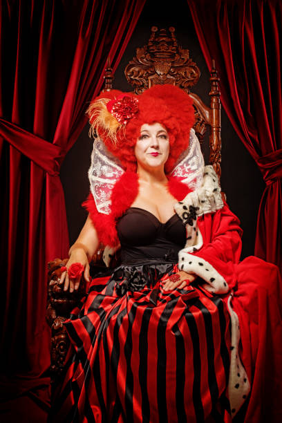 istock Queen of Hearts type character on the throne 1299810031