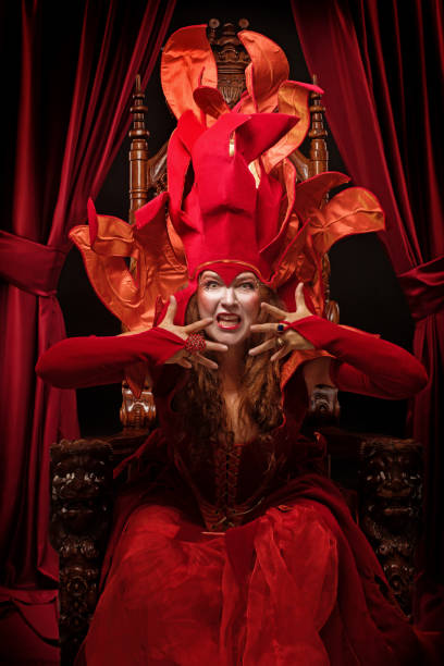 istock Queen of Fire type character on the throne 1299810041