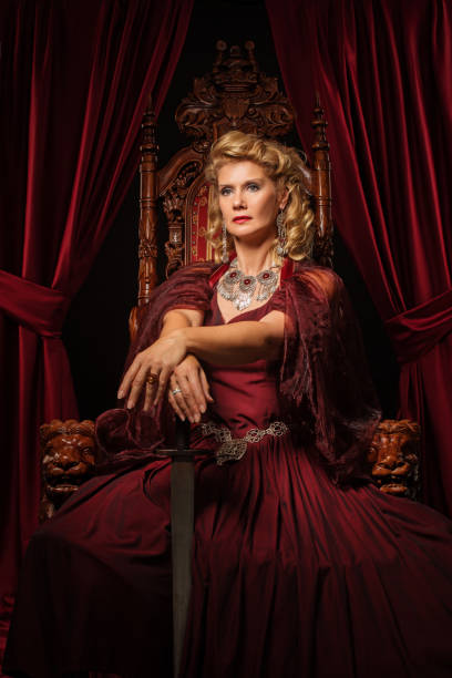 istock Historical Queen character on the throne 1299810050