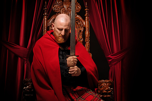 Scottish King on the throne in studio shoot