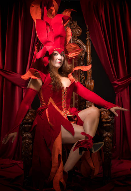 istock Queen of Fire type character on the throne 1299810159
