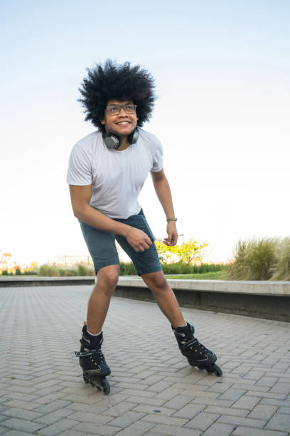 istock Latin man rollerskating outdoors. 1299811165