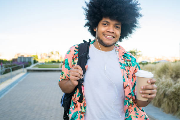 istock Latin man walking outdoors. 1299811172
