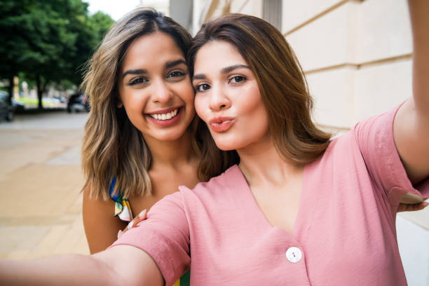 istock Two friends taking a selfie outdoors. 1299811222