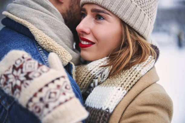 istock Joyful young woman spending winter time with boyfriend 1299811278