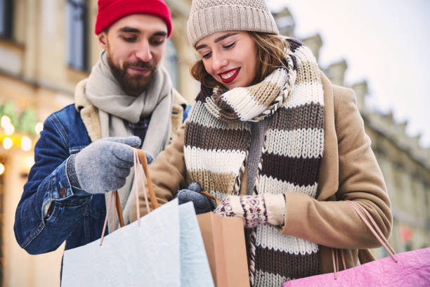 istock Happy couple going shopping together before Christmas 1299811398
