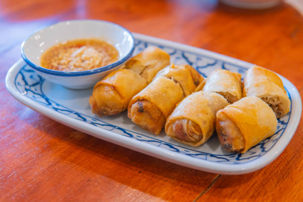 istock Fried chinese spring rolls with sweet chili sauce. 1299811648