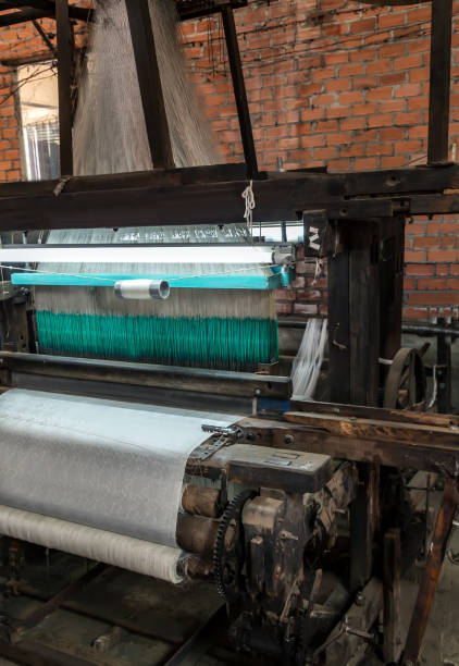 istock Handloom working weaving machine weave handmade fabric 1299812344