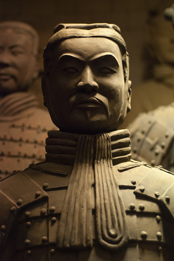 The iconic figures of the Terracotta Army (Bingma yong) warriors stood in their original pits, meticulously reconstructed from their shattered pieces at the UNESCO World Heritage Site at Xi'an, Shaanxi province, China. ProPhoto RGB profile for maximum color fidelity and gamut.