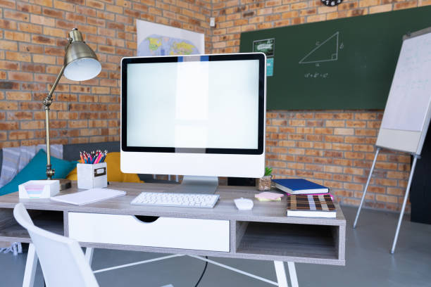 istock Computer on desk and equipment in a teacher's online classroom 1299815487