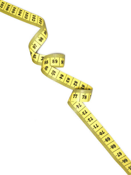 istock Yellow measuring tape isolated on white background 1299815879