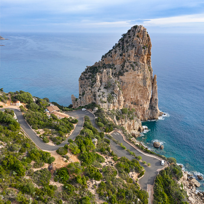 Aerial of the famous Pedra Longa, a rock spike 128m in height which stands exactly on the coastline Baunei, set on the slopes of Mount Santo, includes 30 kilometers of matchless coastal beauty. Converted from RAW.