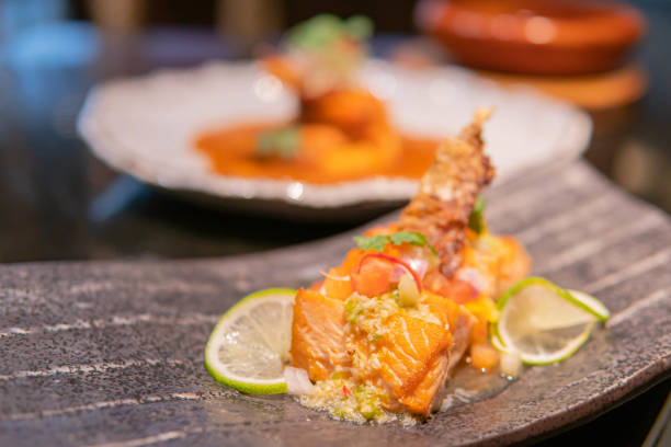 istock Fried salmon fillet with lemon and basil. 1299817105