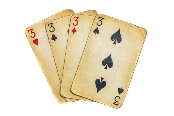 istock Four old dirty threes poker cards on a white background 1299817463
