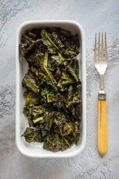 istock Baked kale chips with poppy seeds 1299817674