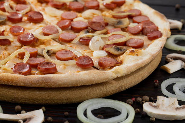 istock pizza with mushrooms and caramelized onions on wood background 1299818483
