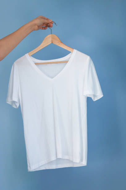 istock Hand is holding a white cloth on a shoulder 1299820717