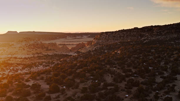 istock Sunlight Creeping Across Utah Desert at Dawn - Aerial 1299826799
