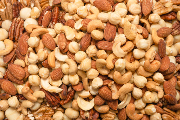 istock Mix of nuts as a background. 1299827665
