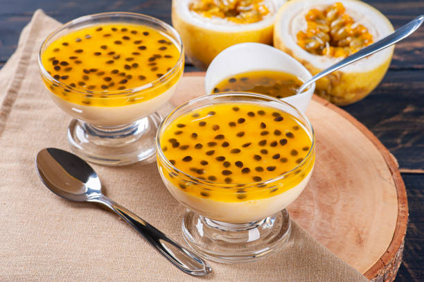 Passion fruit mousse. Refreshing dessert with fresh passion fruit topping Passion fruit mousse. Refreshing dessert with fresh passion fruit topping mousse dessert stock pictures, royalty-free photos & images