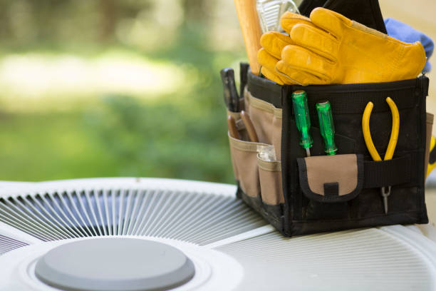 istock Air conditioning service personnel keep home owner unit running efficiently to help save carbon footprint. 1299829313