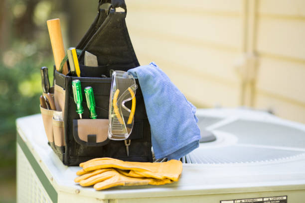 istock Air conditioning service personnel keep home owner unit running efficiently to help save carbon footprint. 1299829356