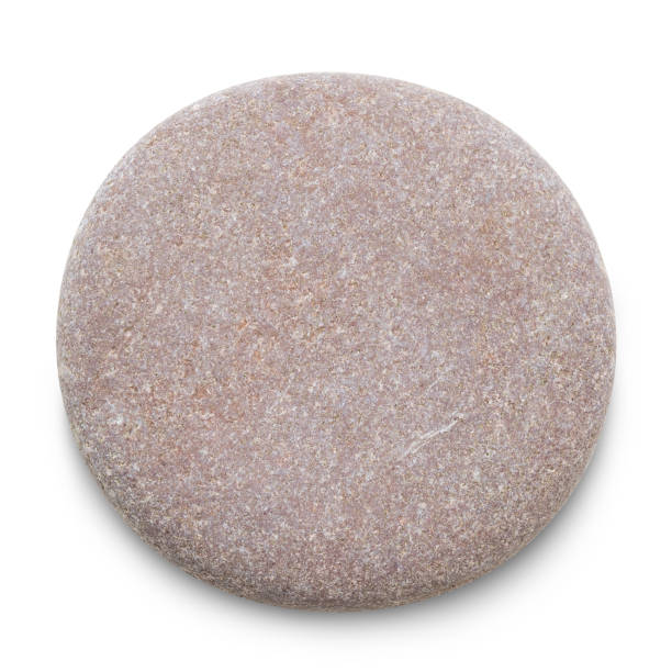 istock Pebble. Smooth red sea stone isolated on white background with shadows, clipping path  for isolation without shadows on white 1299830527