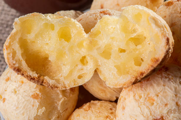 istock Typical Brazilian cheese bread. Close-up photo of some cheese bread. Grey background 1299831718