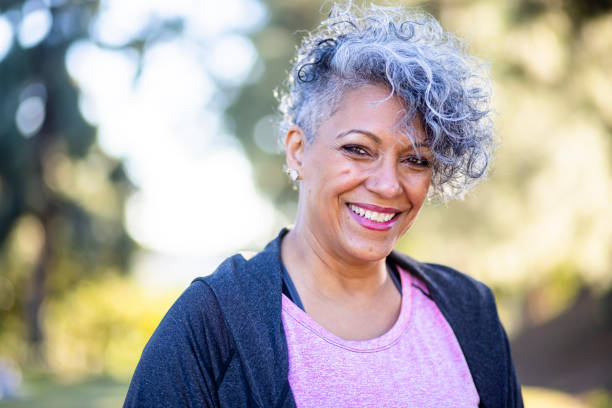 Portrait of a Black Woman A mature black woman enjoying outdoors. womens issues stock pictures, royalty-free photos & images