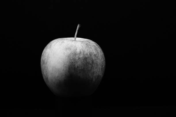istock Appel on black backgroung - Black and White 1299832159