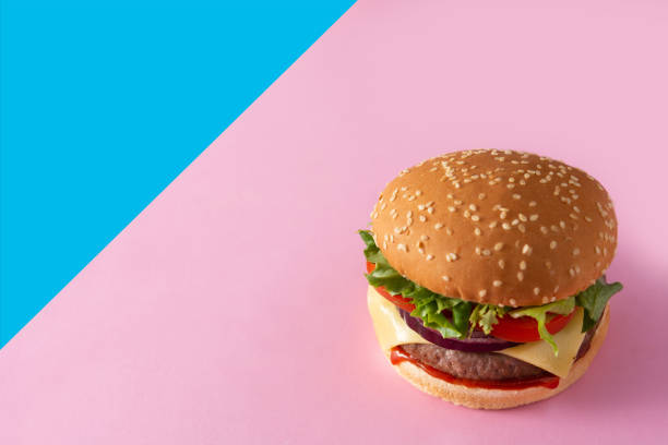istock Cheeseburger with beef,tomato, lettuce and onion 1299832161