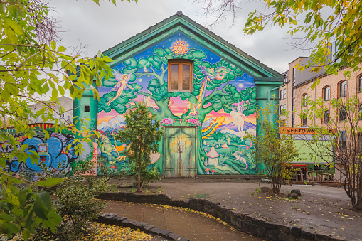 A wall mural of fantasy street art at the entrance to the free living commune of Freetown Christiania in Christianshavn, urban borough of Copenhagen.