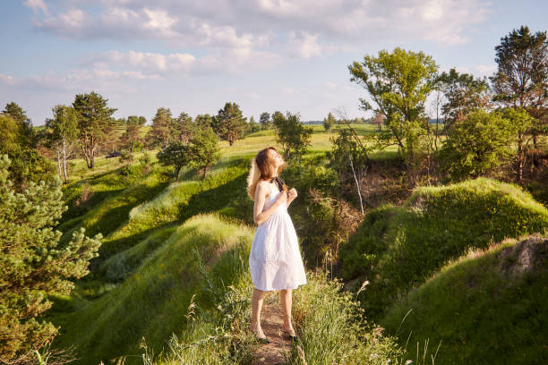 istock girl in the field 1299834355