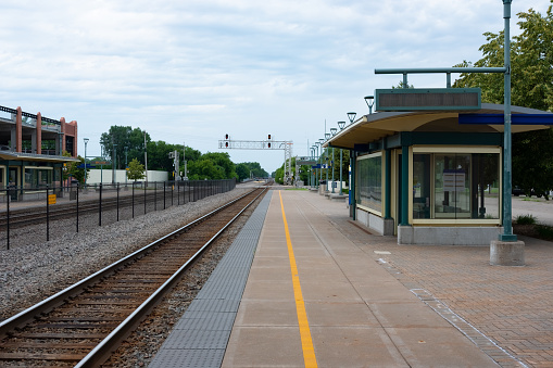 A suburban commuter railroad station in the midwest.