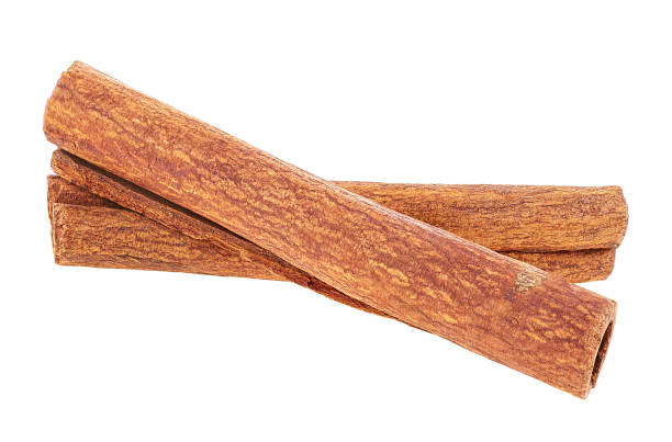 istock Two brown cinnamon sticks isolated on a white background. The image is a cut out. 1299838513