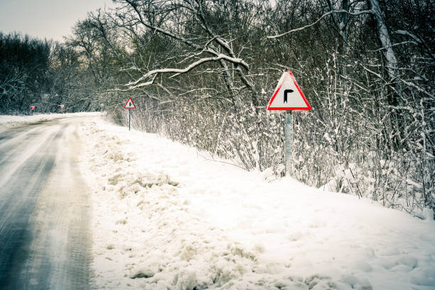 istock Red triangle road sign indicating traffic to the right. 1299842195