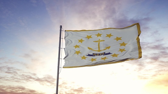 State flag of Rhode Island waving in the wind. Dramatic sky background. 3d illustration.