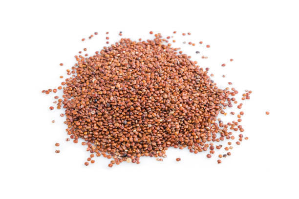 istock Pile of raw red quinoa isolated on white background. Side view, close up, macro. 1299846872