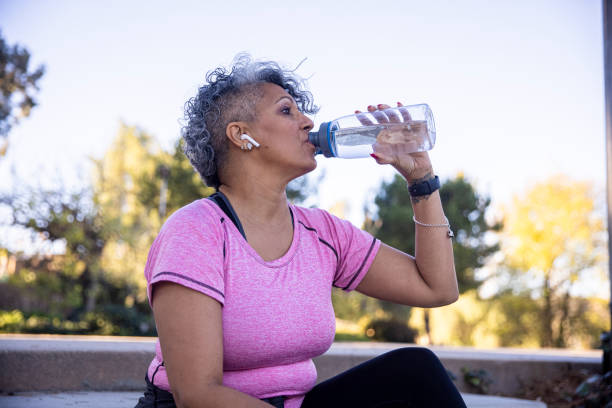 istock Black Woman Hydrating after Workout 1299849214