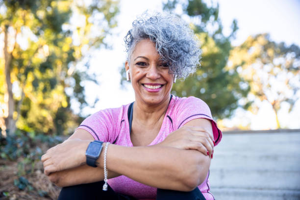 Portrait of a Black Woman A mature black woman enjoying outdoors. wristwatch photos stock pictures, royalty-free photos & images