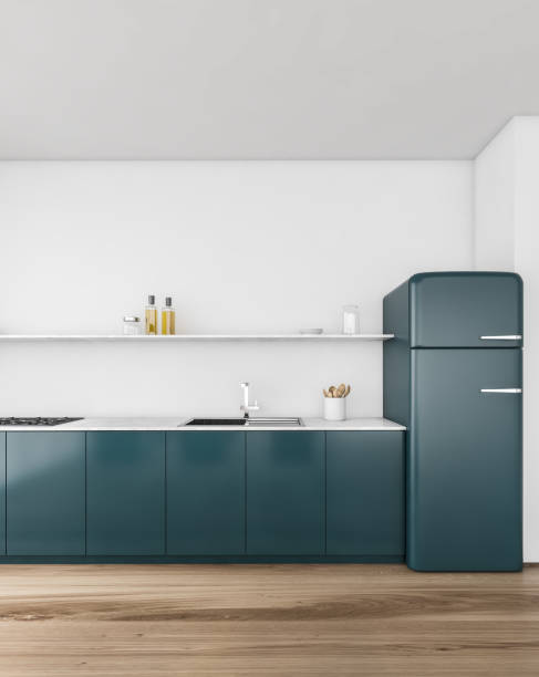 istock Blue kitchen set against white wall, wooden floor in minimalist kitchen 1299849500