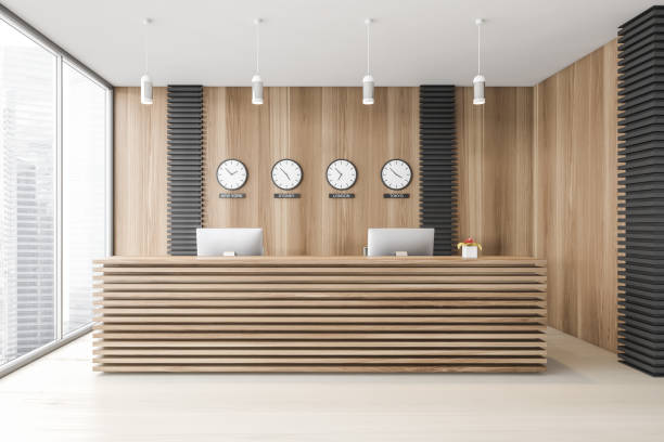 istock Wooden office waiting room with reception and clocks 1299849537