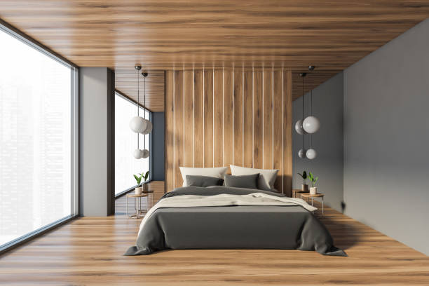 istock Gray and wooden master bedroom interior 1299849587