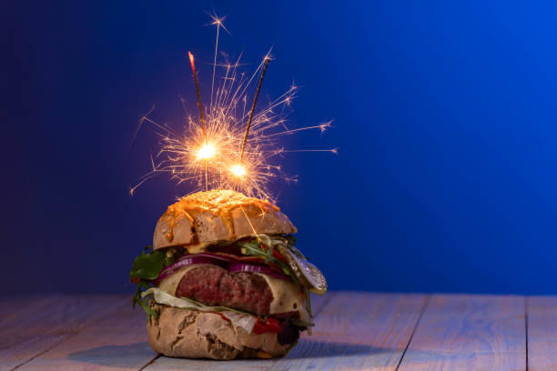 home made cheeseburger on dark wood